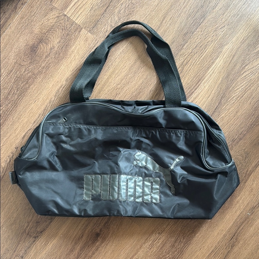 NWOT Puma Black Duffel Bag with Water-Resistant Design